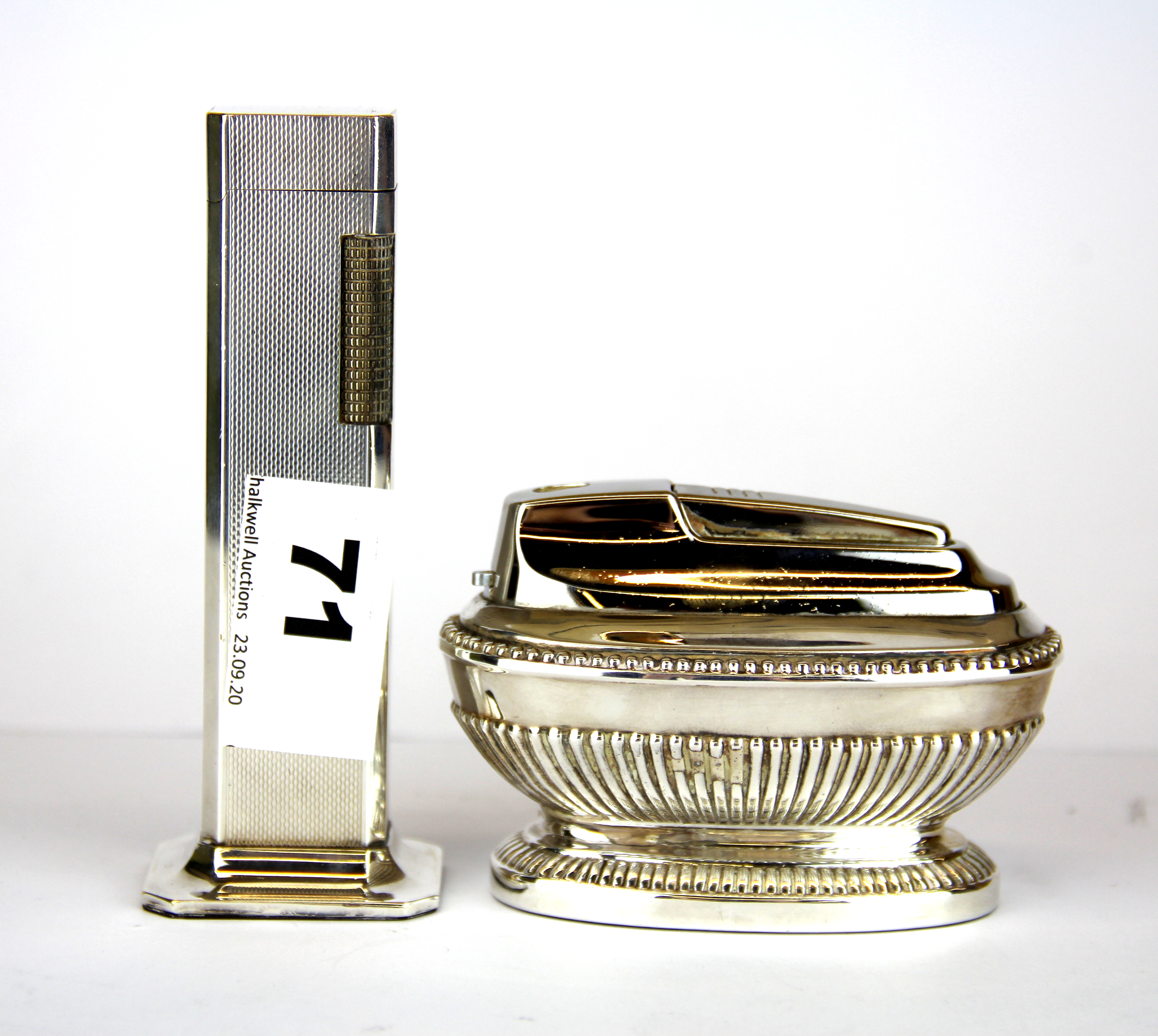 A Dunhill silver plated table lighter, H. 11cm, together with a Ronson silver plated table lighter.