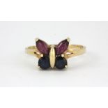 A 9ct yellow gold sapphire and pink tourmaline set butterfly shaped ring, (N.5).