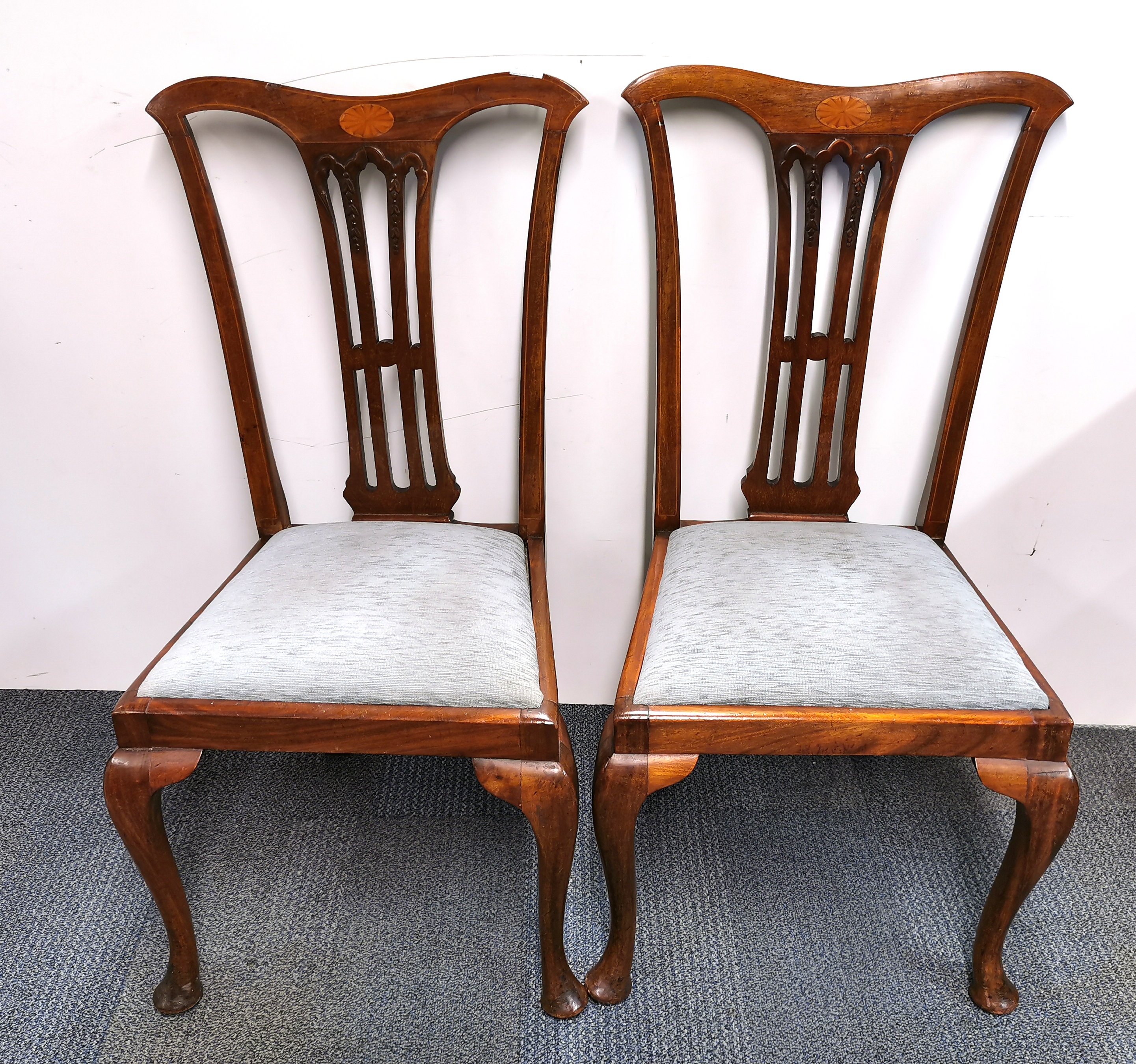 A pair of inlaid mahogany Chippendale style dining chairs.