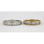Two 9ct yellow and white gold stone set half eternity rings, (O.5).
