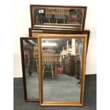 A group of framed mirrors.