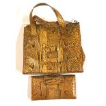 A vintage snake skin handbag and matching purse.