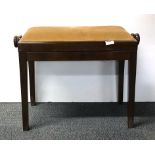 A contemporary adjustable piano stool.