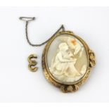 A yellow metal mounted (tested minimum 9ct gold) carved cameo brooch depicting goddess Hebe and