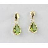 A pair of 9ct yellow gold peridot set drop earrings, L. 1.2cm.