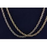 Two yellow metal (tested 9ct gold) chains, L. 60cm.