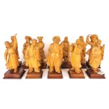 A group of twelve Chinese carved wooden figures, H. 17cm.