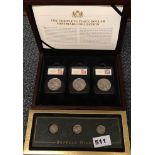 A box set of three silver dollars with a boxed set of Buffalo nickles.