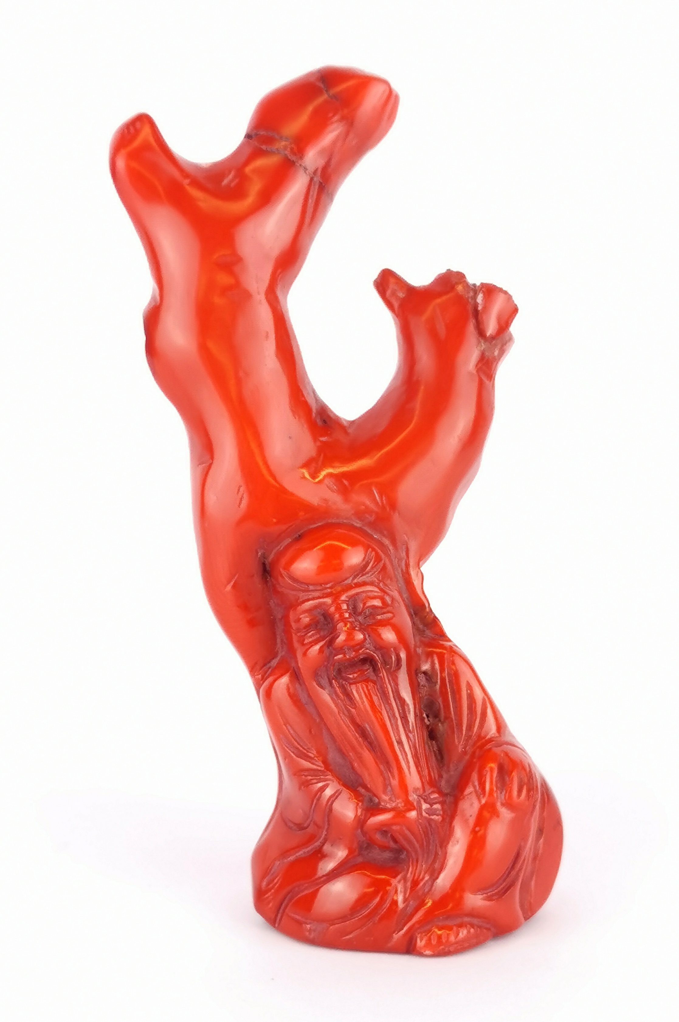 A Chinee carved coral figure of Shou Lao, H. 12cm.