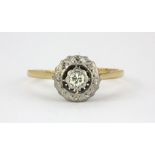 An early 20th century 18ct yellow gold and platinum diamond set ring, (P.5).