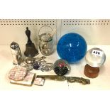 Two paperweights, a crystal ball and various small items.
