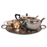 A three piece silver plated tea set with silver plated tray and a further silver plated tea pot.