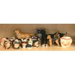 Two Beswick dog figures with a quantity of Royal Doulton mini character jugs etc.