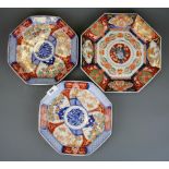 A pair of early 20th Century Japanese Imari octagonal plates, Dia. 25cm, together with a further