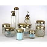 A group of nine hallmarked silver topped dressing table items, together with a cut crystal