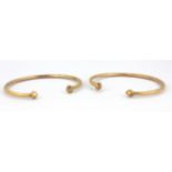 Two yellow metal (tested minimum 14ct gold) adjustable bangles.