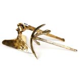 A small bronze display model of a patent 'CQR' single fluke plough anchor with hinged shank.