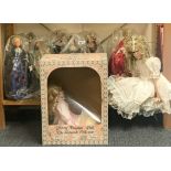 A set of 1970's dolls, King Henry VIII and his six wives, with a seated porcelain girl doll and