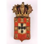 An 18th / 19th century carved wooden Portuguese coat of arms, H. 19cm.