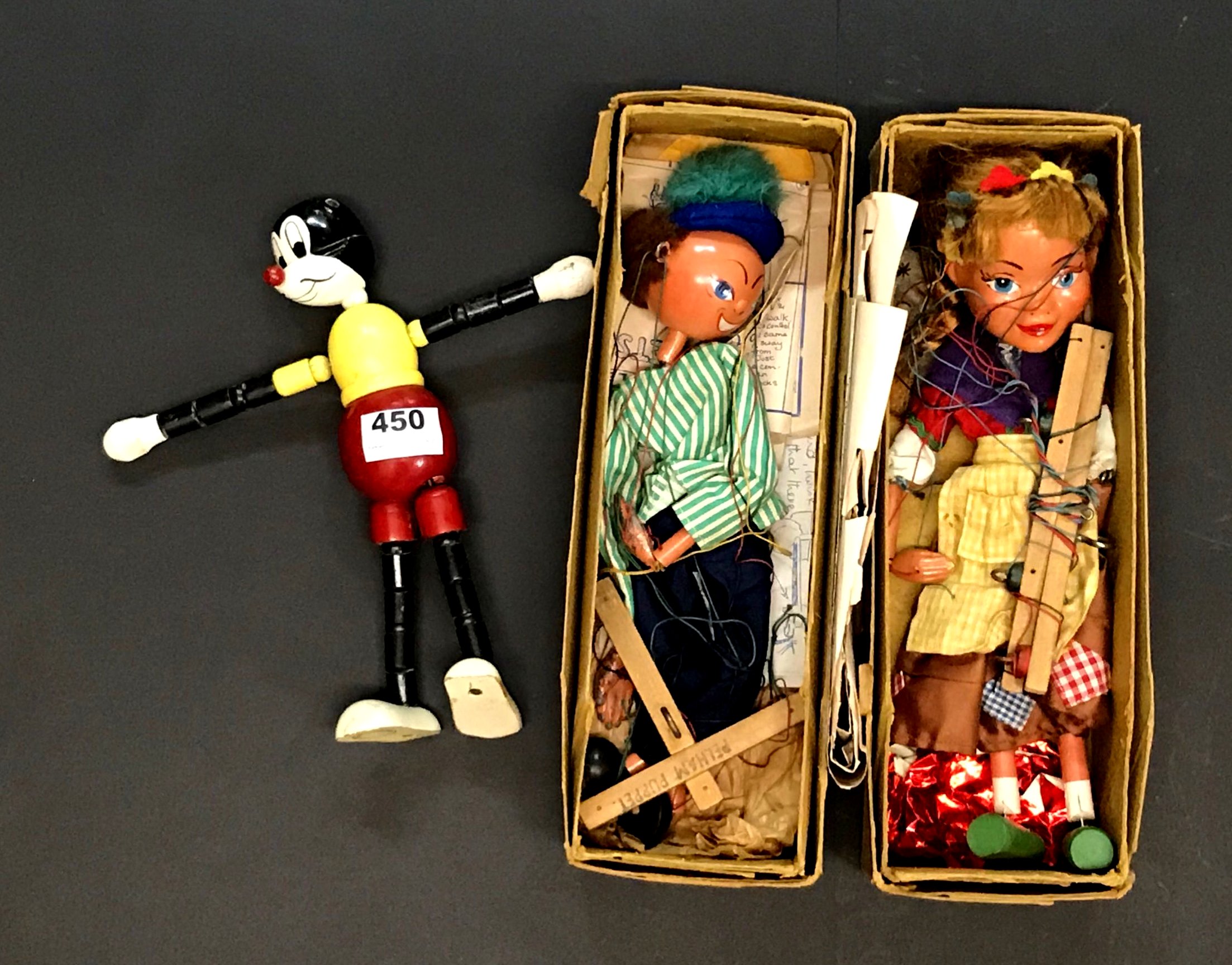 A Swedish wooden Mickey Mouse toy, H. 25cm, and two Pelham puppets.