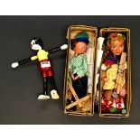 A Swedish wooden Mickey Mouse toy, H. 25cm, and two Pelham puppets.