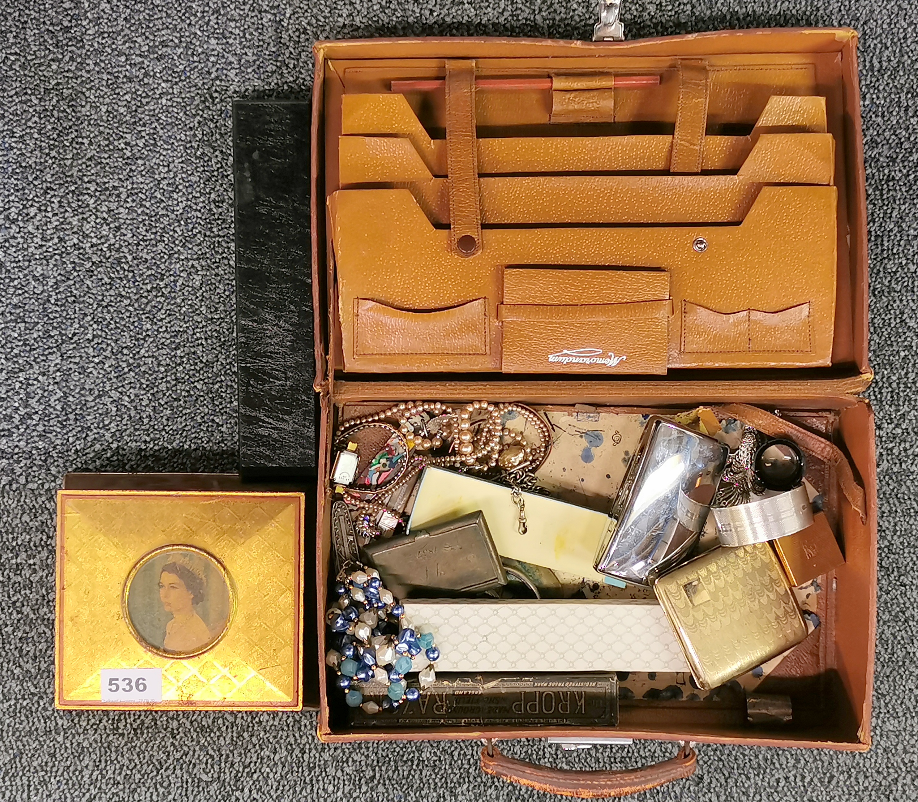 A vintage leather case and contents.