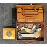 A vintage leather case and contents.