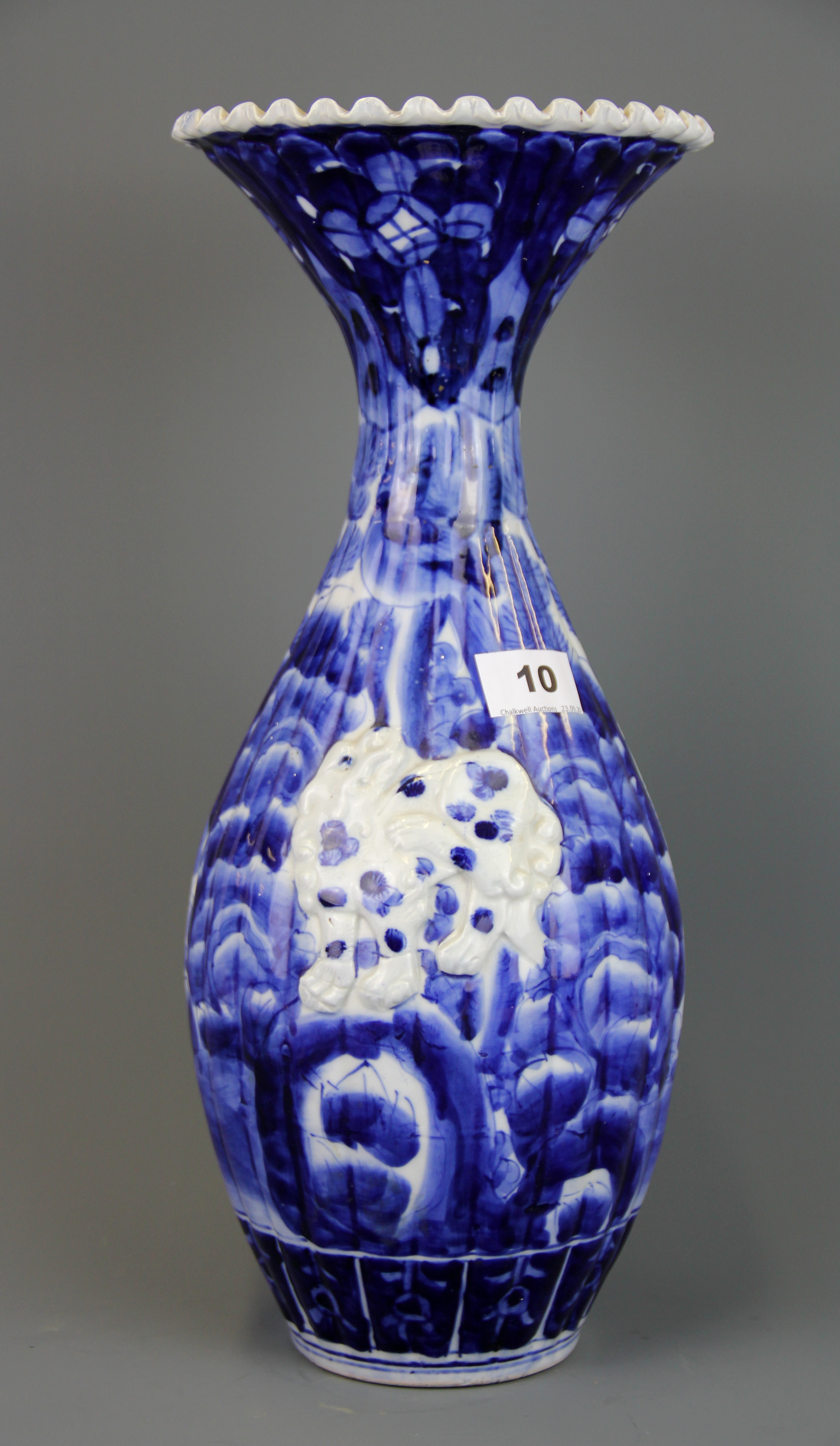 A 19th Century Japanese relief decorated porcelain vase, H. 41cm, together with a satsuma figure