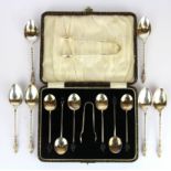 A cased set of hallmarked silver coffee bean spoons, a set of silver tea spoons and a silver