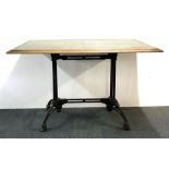 An unusual cast iron based table with oak and tin top, 120 x 80cm.