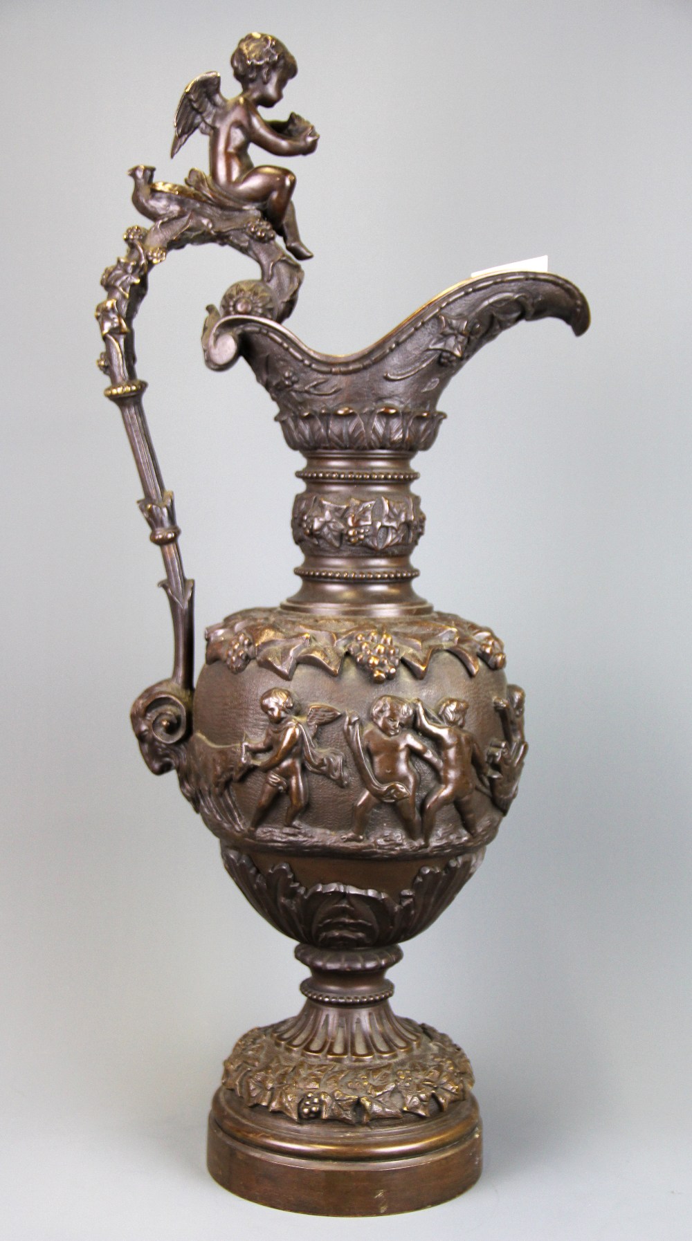 A large 19th Century bronze urn decorated with putti, H. 57cm. - Image 2 of 2