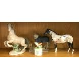 A Beswick horse figure together with three further horse figures.