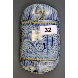 A Chinese hand painted porcelain wrist rest for taking the pulse, L. 17cm.