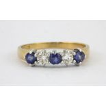 An 18ct yellow gold sapphire and diamond set ring, (M).