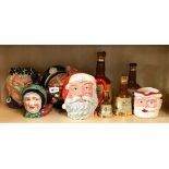 Three large Royal Doulton character jugs, a Beswick teapot, a Father Christmas jug and Wade