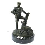 A patinated bronze figure of a huntsman and his dog on a black marble base after Moreau, H. 27cm.