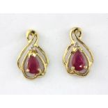 A pair of 9ct yellow gold ruby and diamond set earrings, L. 1.2cm.