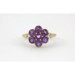 A 9ct yellow gold amethyst set cluster ring with diamond set shoulders, (N).