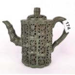 A Chinese pierced green clay Yixing terracotta teapot, H. 18cm.