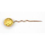 A Spanish Charles III half Escudo gold coin (c. 1786) set on a gold tie pin.