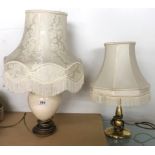 A group of six ceramic and brass table lamps.