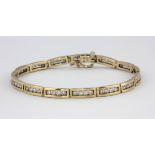 A 9ct yellow gold brilliant cut diamond set bracelet, L. 18.5cm, approx. 3ct overall.