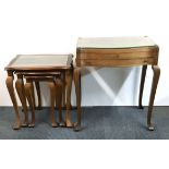 A walnut veneered table case containing a silver plated cutlery set, together with a nest of three