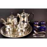 A pair of Victorian porcelain inkwells, H. 9cm, and a five piece silver plated tea set.