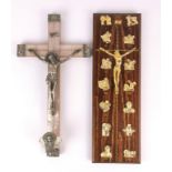 An early 20th century celluloid and white metal crucifix, with a further hardwood crucifix, H.