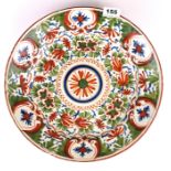 An 18th century Dutch Delft polychrome charger, Dia. 35cm.