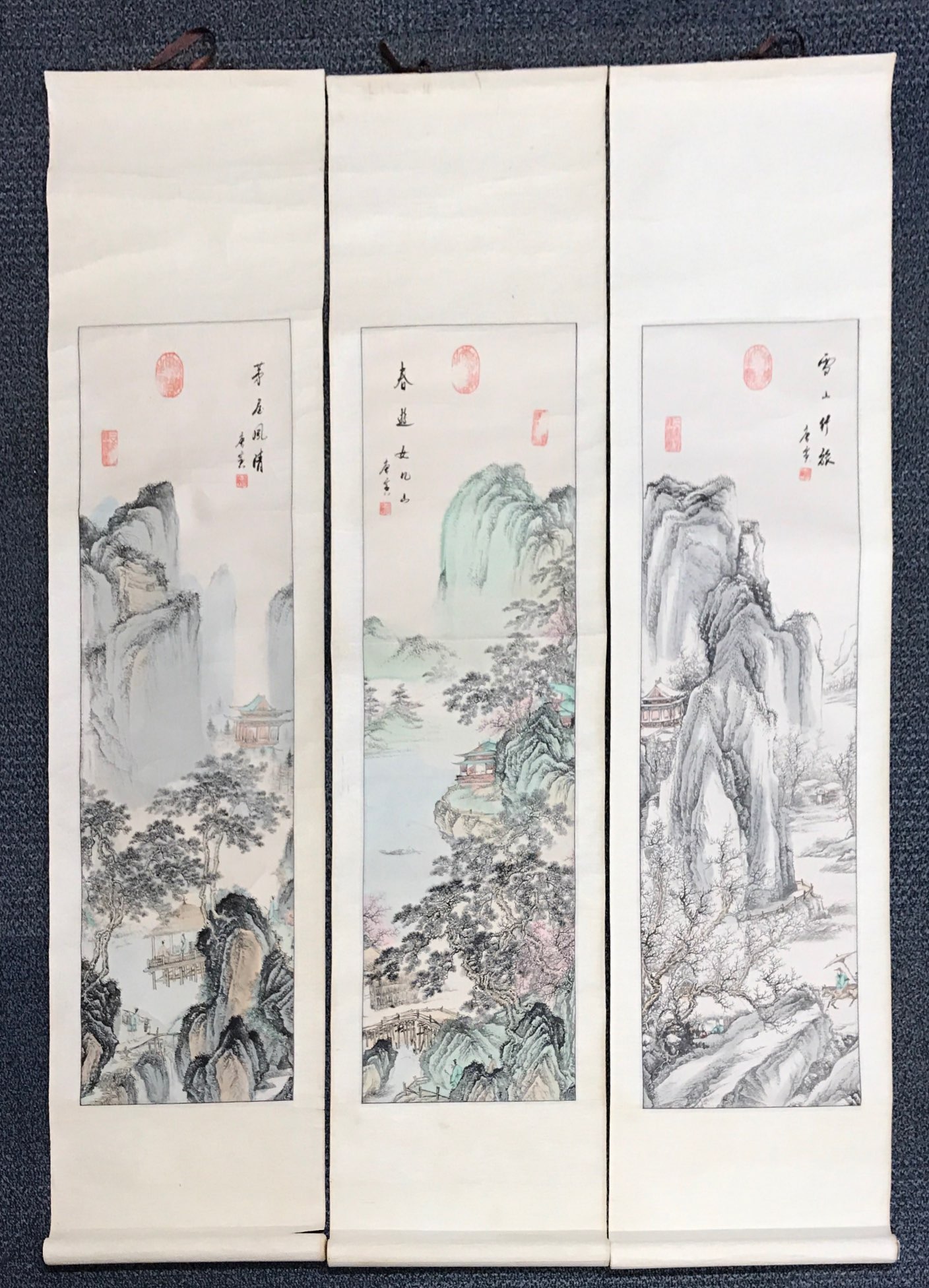 A group of three Chinese mid 20th Century hand painted silk mounted scrolls of mountain