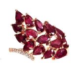 A 925 silver rose gold gilt ring set with pear cut rubies and white stones, (O).