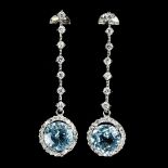 A pair of 925 silver drop earrings set with blue topaz and white stones, L. 4.2cm.