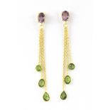 A pair of 925 silver drop earrings set with faceted cut peridots and oval cut amethysts, L. 7.1cm.